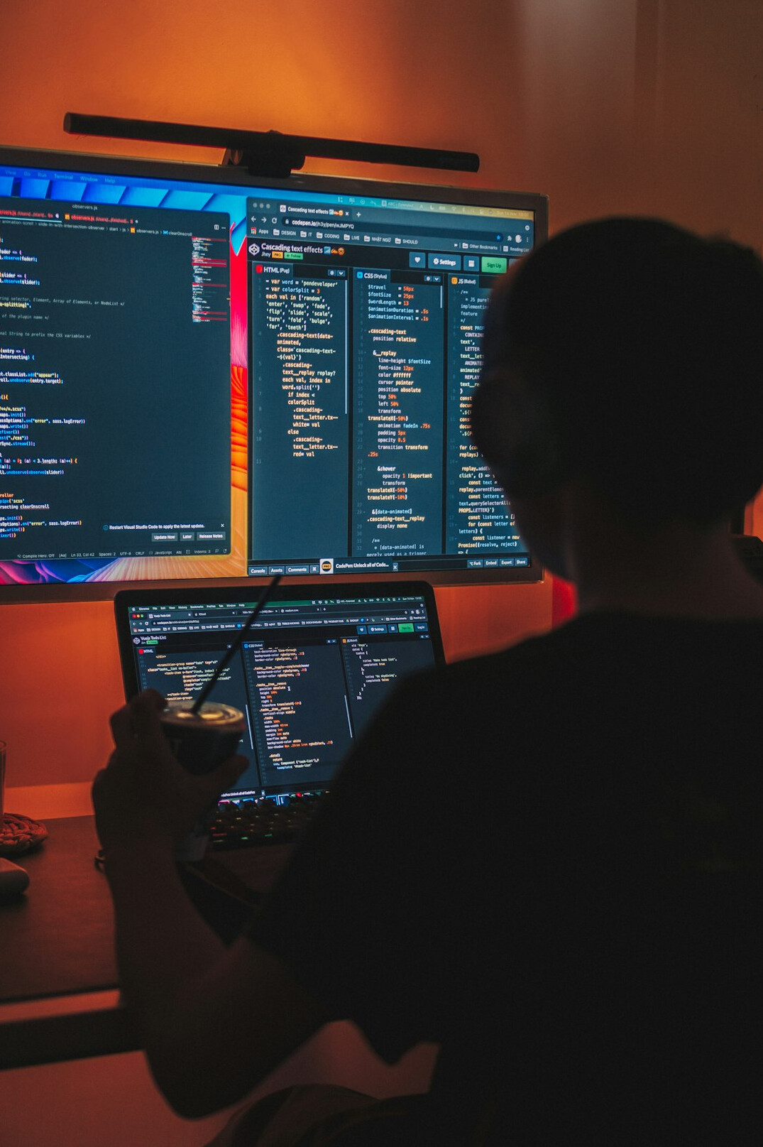 young programmer coding at desk