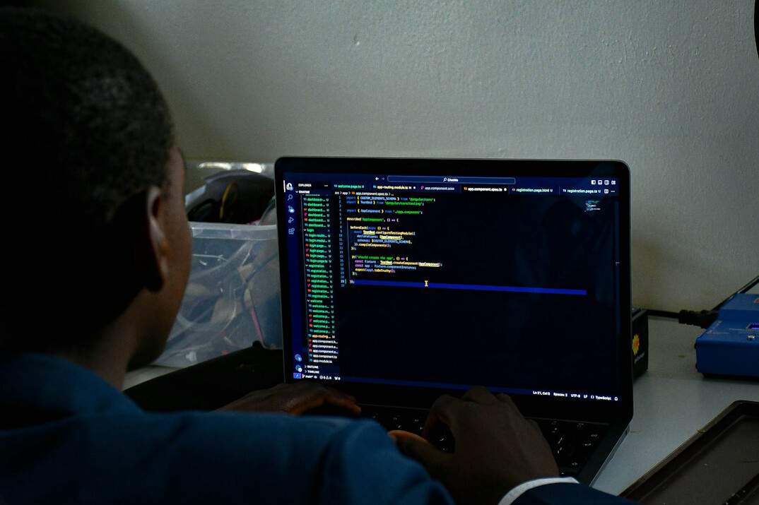 beginner programmer typing code