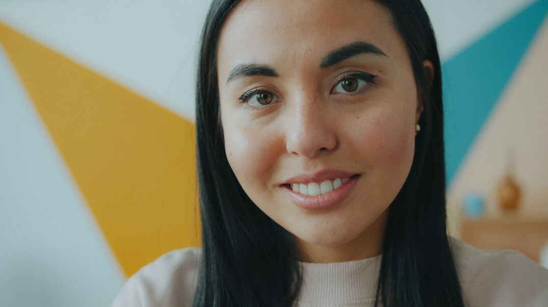 Studio portrait of a Croatian woman software mentor smiling