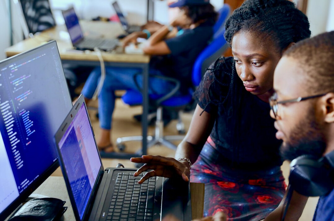 group of students coding together
